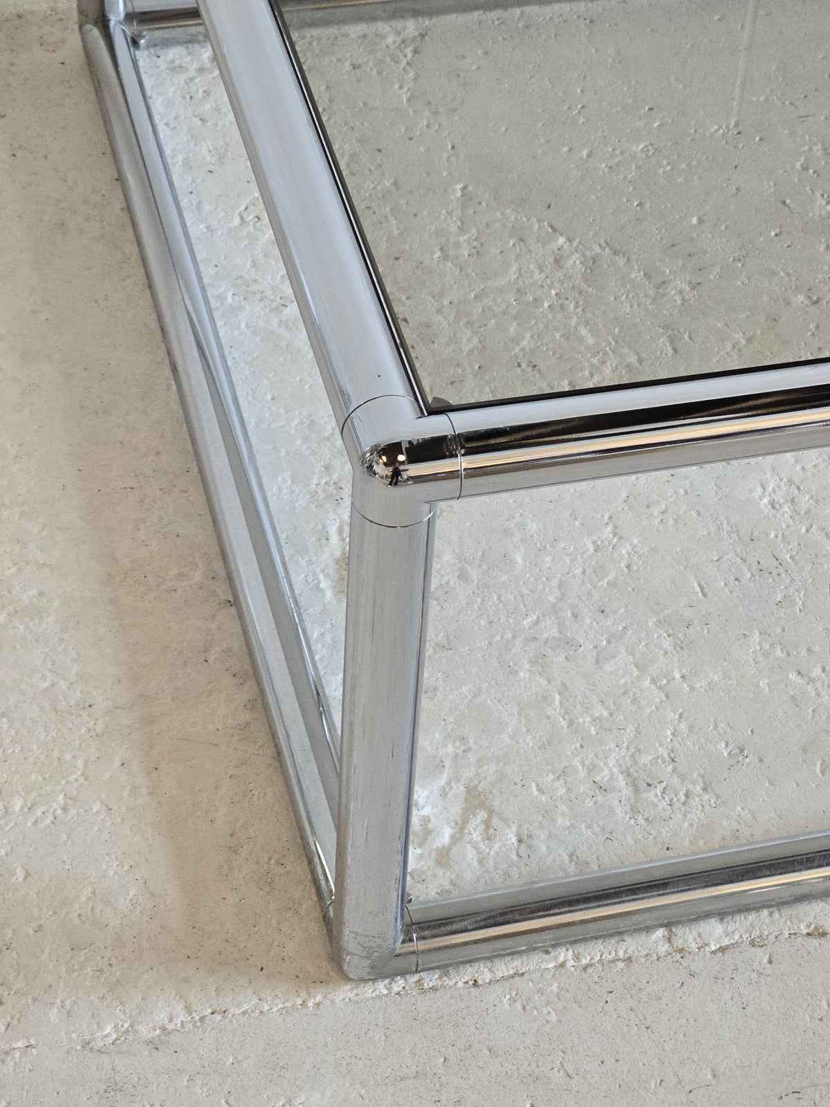 Tubular chrome and tinted glass coffee table