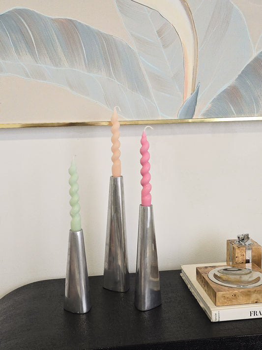 A set of three candleholders