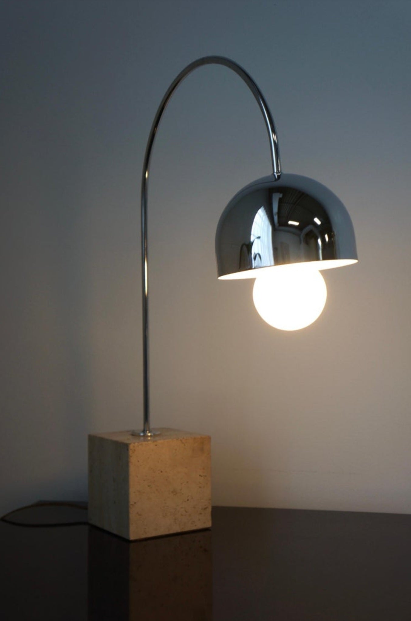 Harvey Guzzini Arc Chrome and Travertine Table Lamp