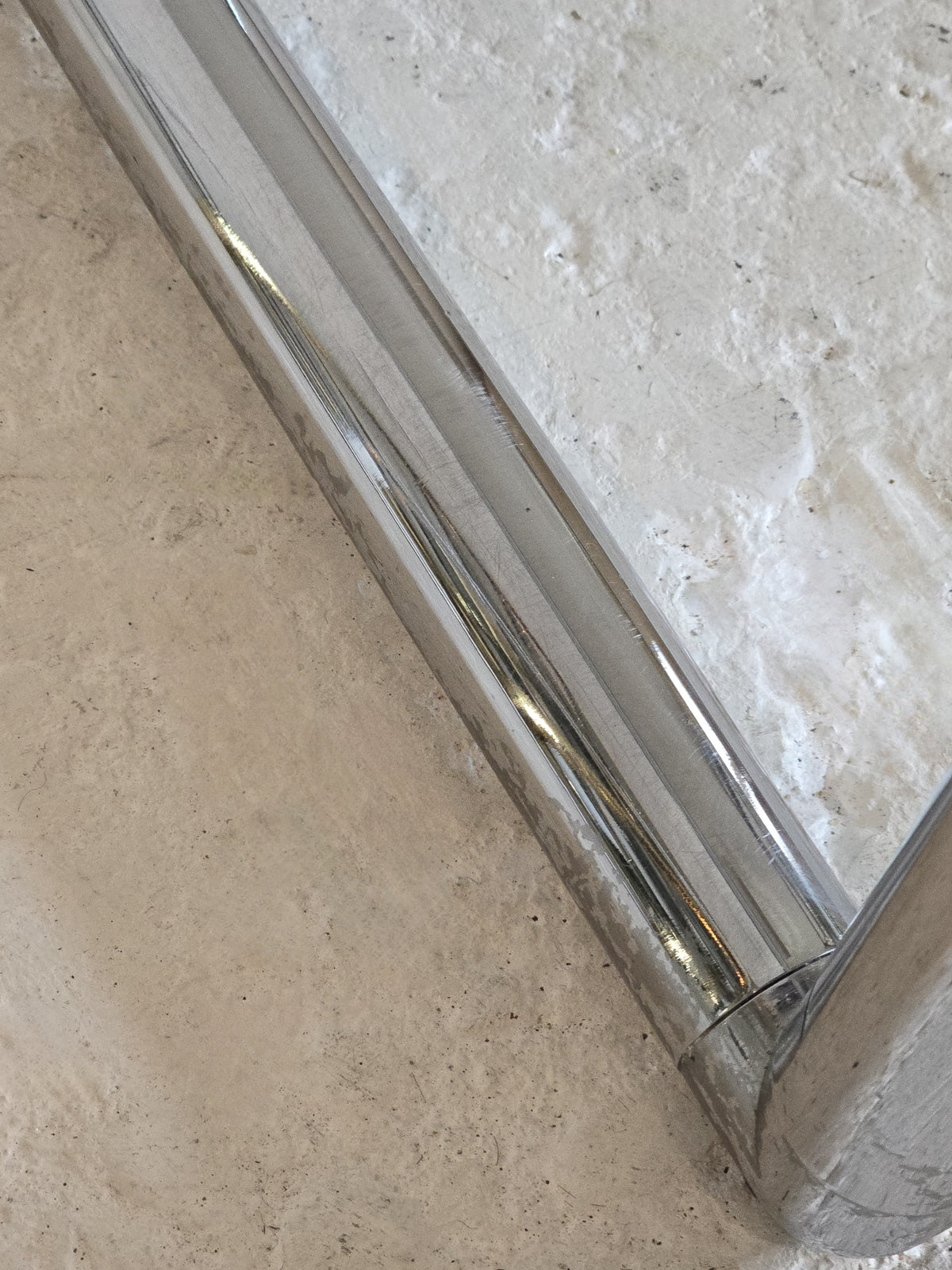 Tubular chrome and tinted glass coffee table